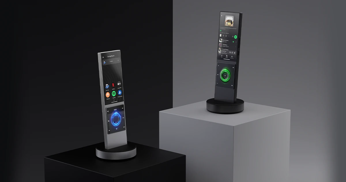 Two AVA Cinema remotes displayed on charging docks